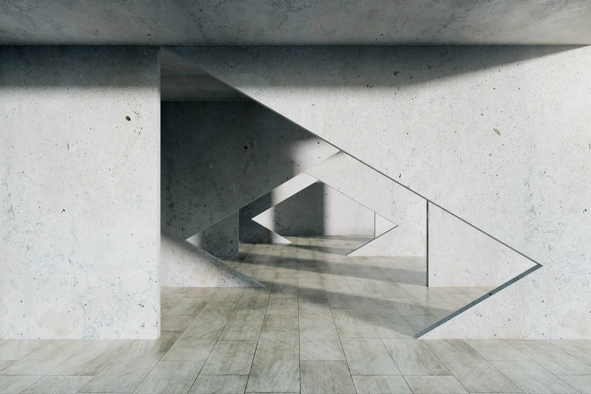 A concrete wall cut through with nested triangular openings, the structure standing around the voids.